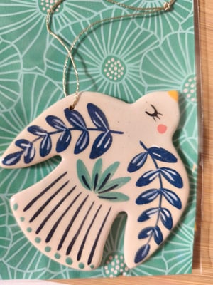 Image of     Petit oiseau à suspendre bleu turquoise 