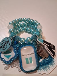Image 1 of Tiff with blue sparkles 