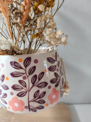 Image of   Pot suspendu feuillage bordeau 