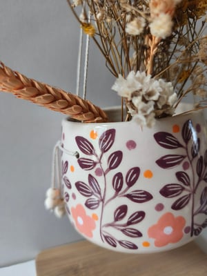 Image of   Pot suspendu feuillage bordeau 