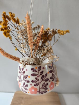 Image of   Pot suspendu feuillage bordeau 