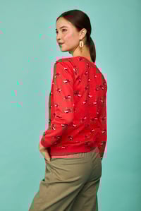 Image 1 of Sudadera perrito fondo rojo