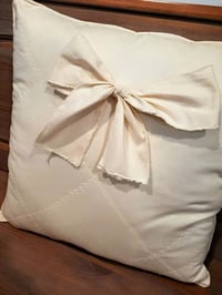 Image 1 of Cream Quilted/bow tie throw pillow 16x16