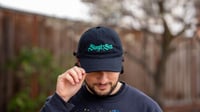 Image 4 of SWEPT TO SEA LOGO CAP - BLACK WITH TEAL EMBROIDERY 