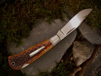 Image 1 of Remington 1306 pattern lockback folder in amber jigged bone