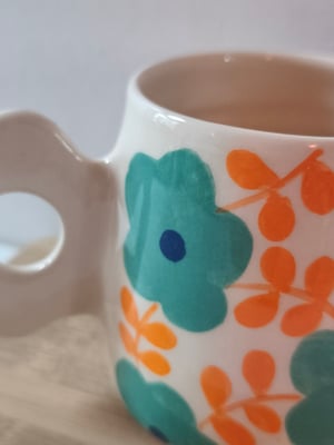 Image of    tasse anse fleur bleu turquoise 