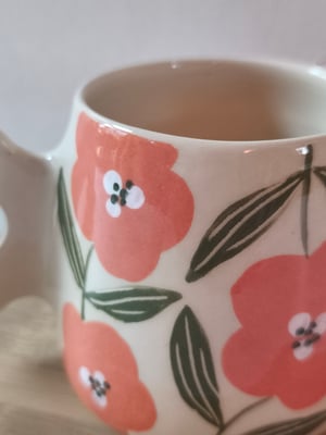 Image of   tasse anse fleur corail 