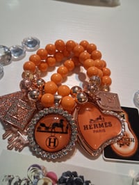 Image 1 of H in orange 