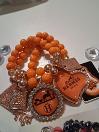 Image 3 of H in orange 