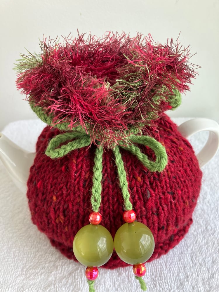 Image of small RED Go On! tea cosie