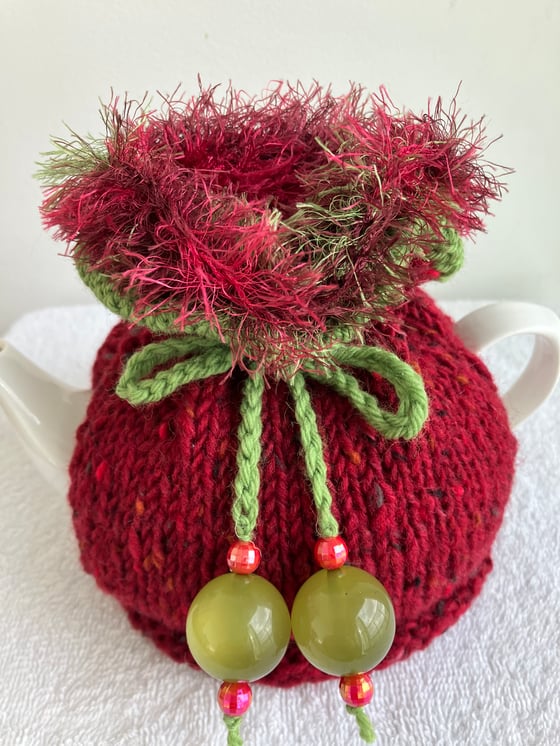 Image of small RED Go On! tea cosie