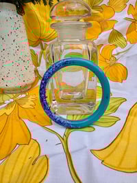 Image 1 of Brune jardin turquoise