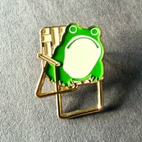 Image 1 of Sumi Frog in Lawn Chair Enamel Pin in Gold Plating