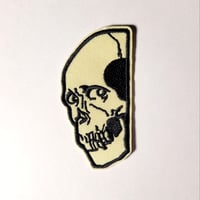 Image 1 of Skull Peaking Around The Corner Embroidered Patch With Merrowed Edge
