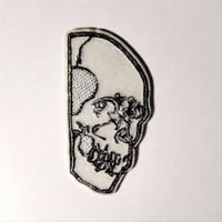 Image 2 of Skull Peaking Around The Corner Embroidered Patch With Merrowed Edge