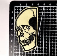 Image 3 of Skull Peaking Around The Corner Embroidered Patch With Merrowed Edge