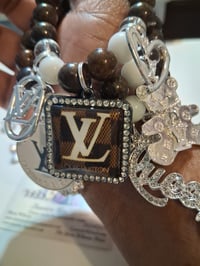 Image 1 of Lv in chocolate brown 