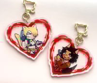 Image 2 of re4 kitty and wolfy keychains