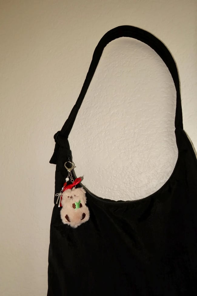 red bowed bear charm