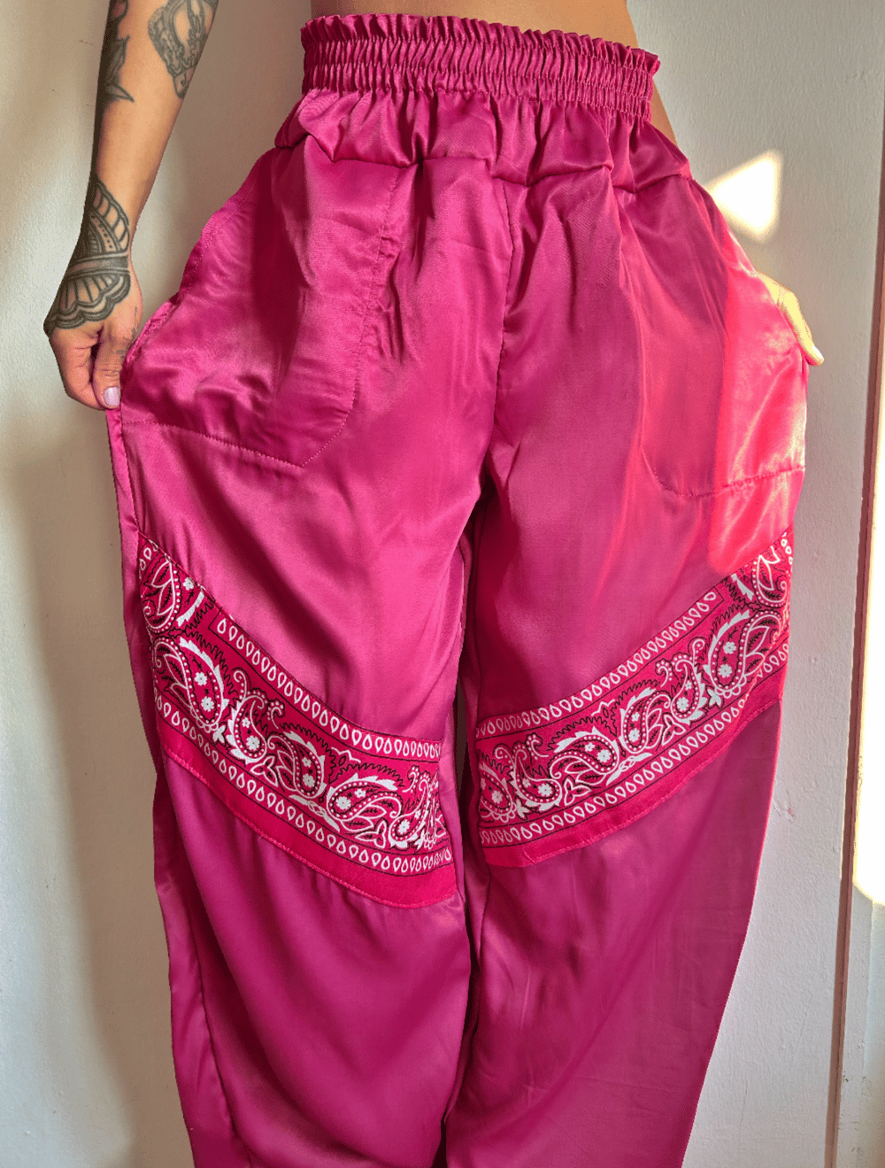 Image of the pink satin bandana trousers 