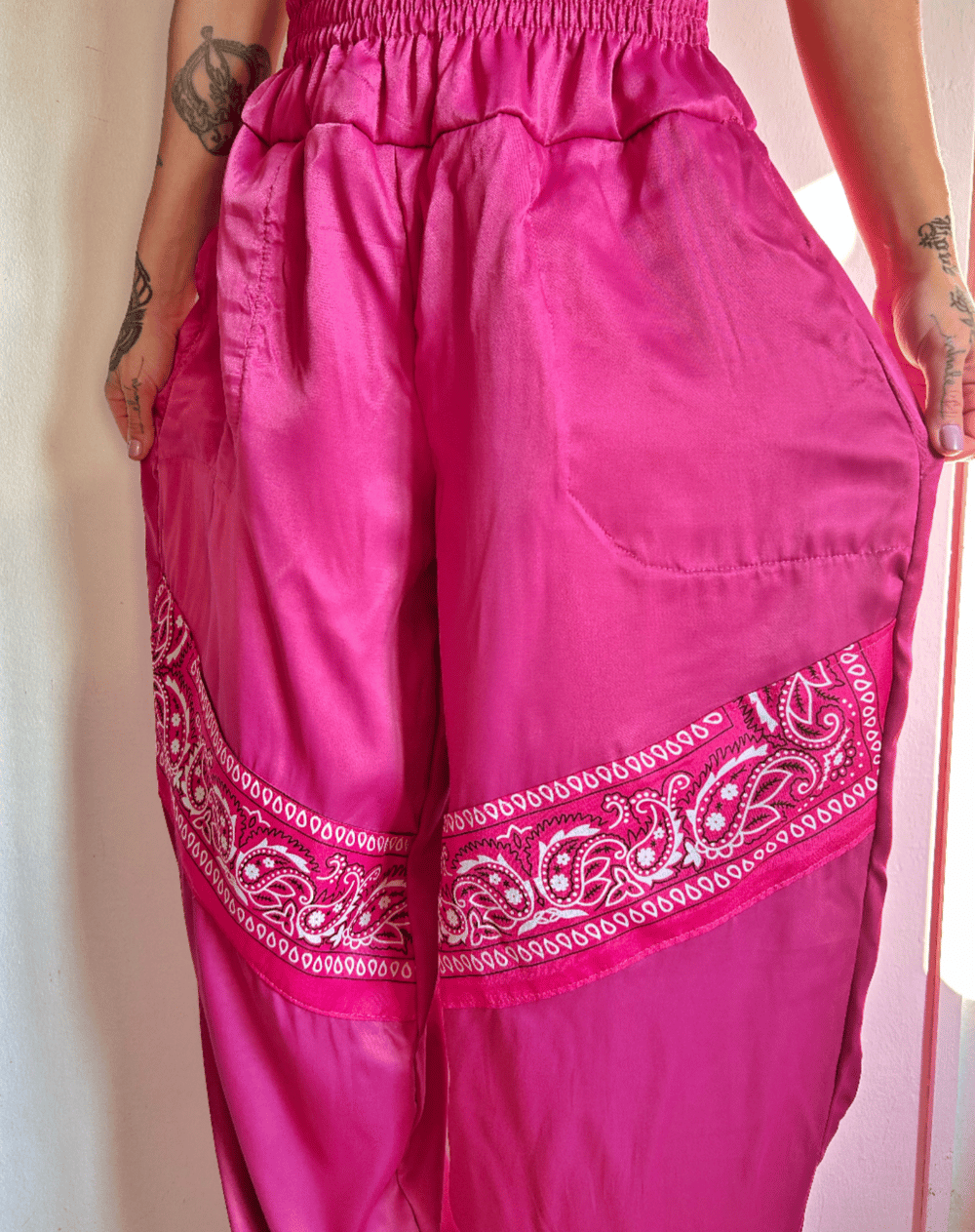 Image of the pink satin bandana trousers 