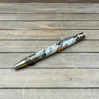 Image 1 of Handmade Fly Fishing Pen with USPS Fly Stamps in Antique Brass