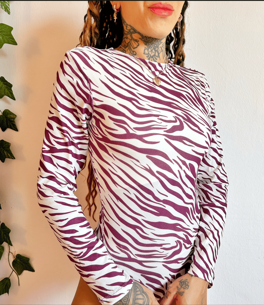 Image of the lavender haze zebra bodysuit 