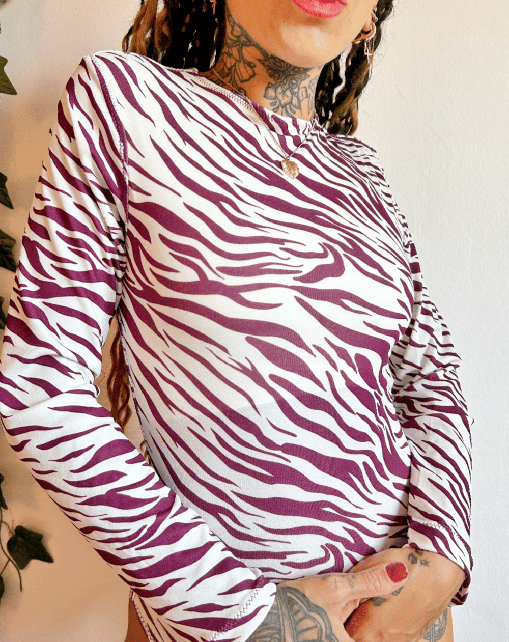Image of the lavender haze zebra bodysuit 
