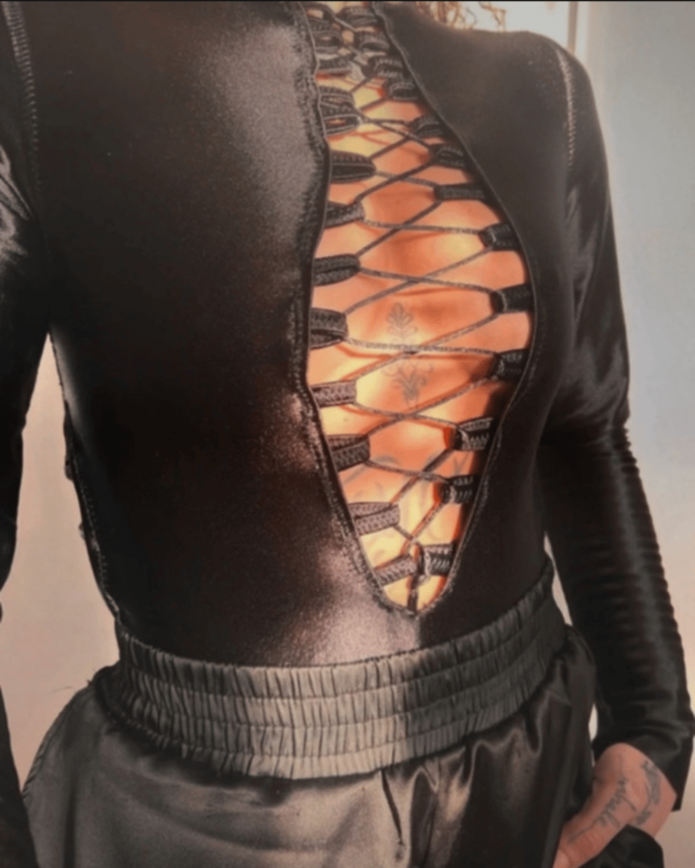 Image of black 100% adjustable bodysuit