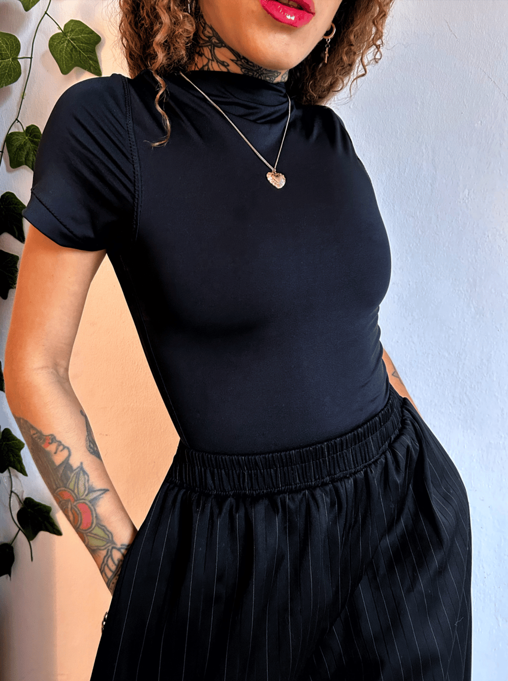 Image of adjustable black lycra blouse