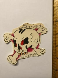 Image 1 of 1950’s Spaulding & Roger’s hand colored cut out skull flash 