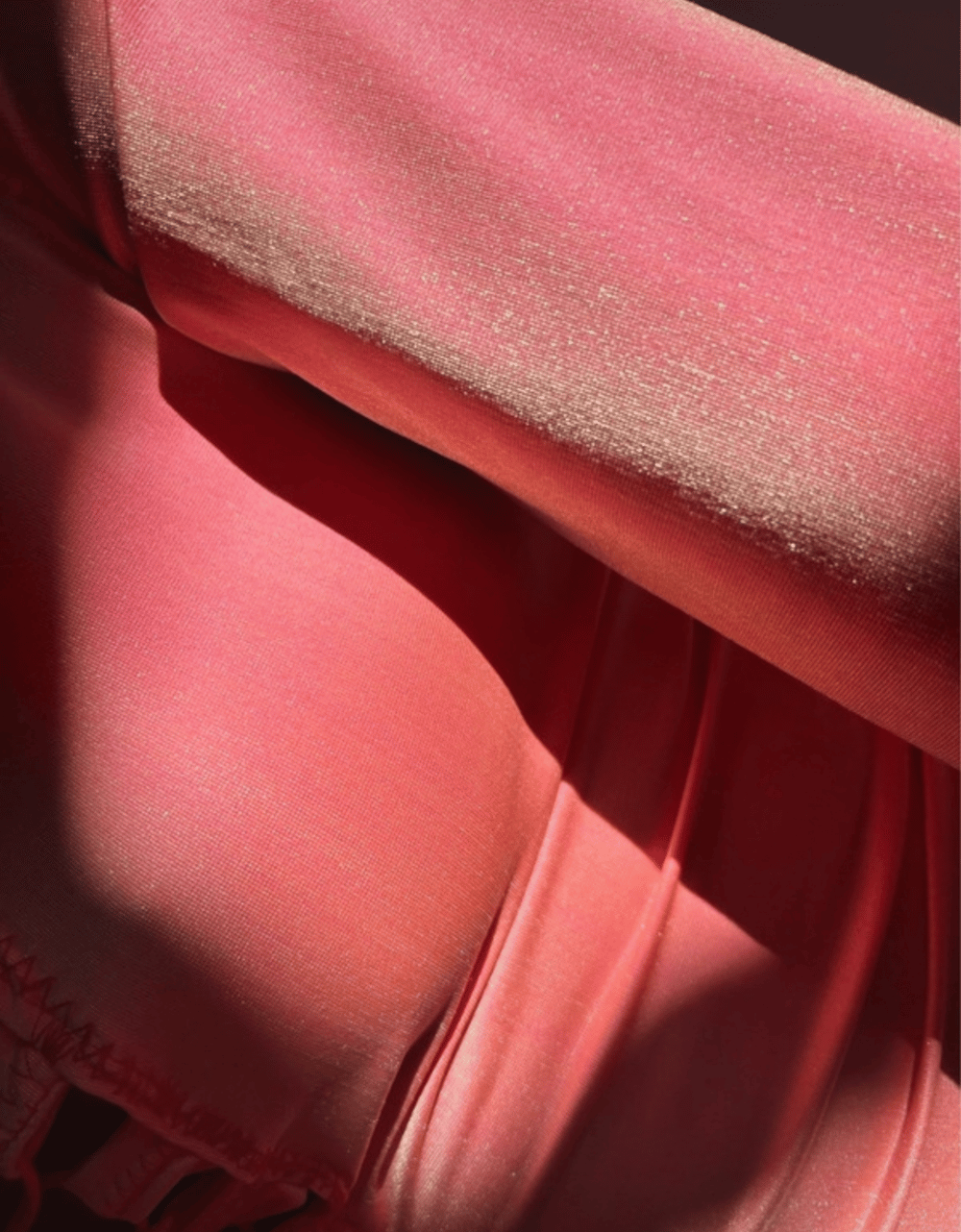 Image of the shiny coral wrap-waist bodysuit