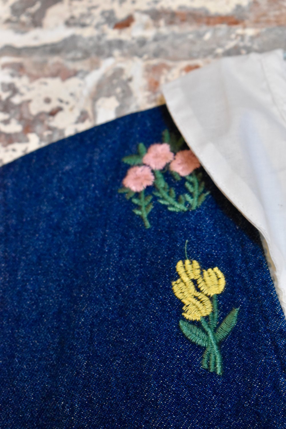 Image of embroidered denim gilet + white blouse 
