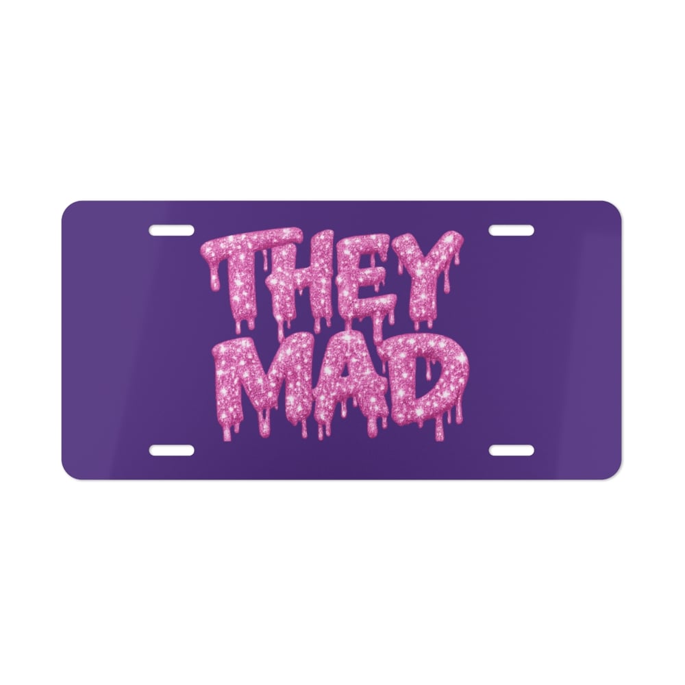 Image of They Mad Vanity Plate — Pink Drip Glitter Text on Purple License Plate