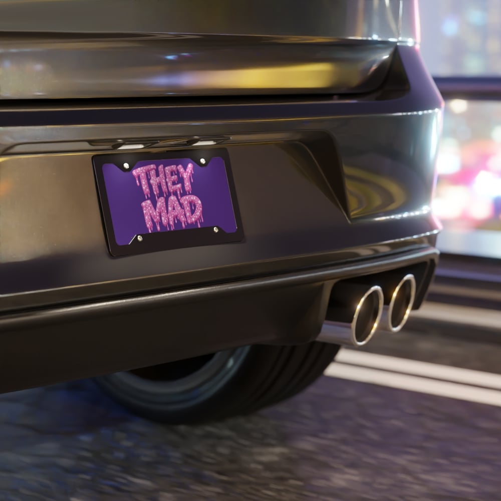 Image of They Mad Vanity Plate — Pink Drip Glitter Text on Purple License Plate