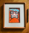 Daruma painting in Japanese frame 