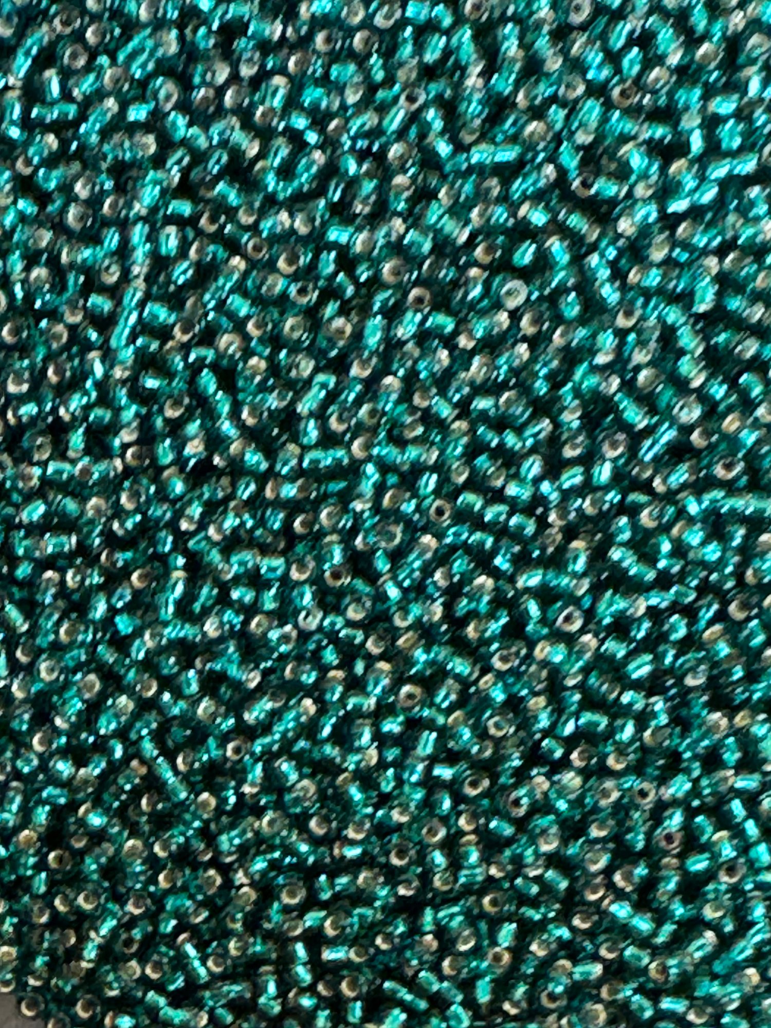 Silverlined transparant dark teal, Miyuki seed beads str.11