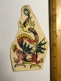 Image 1 of 1970’s Spaulding & Roger’s hand colored production pork chop dragon 