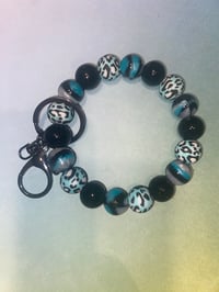 Black and turquoise wristlet keychain