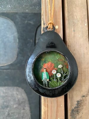 Image of pocket watch diorama -in the garden