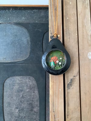 Image of pocket watch diorama -in the garden