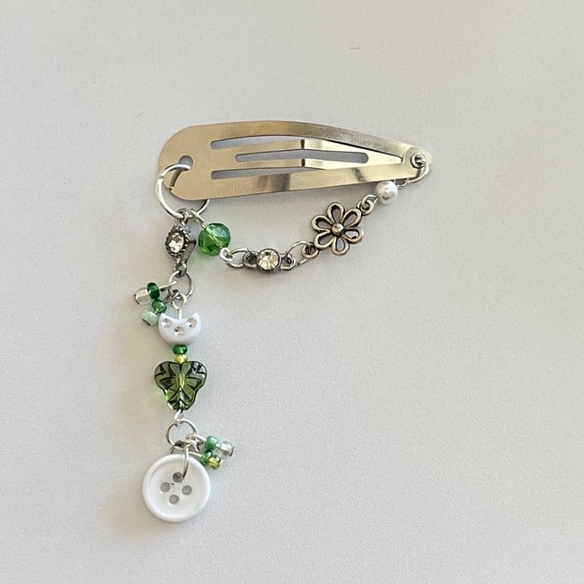 green button hair clip