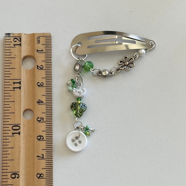 green button hair clip