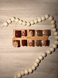 Image 1 of SHORT SQUARE BROWN TUSCAN CROSS ACRYLIC NAILS