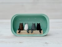 Image 1 of Sardine can with four cats