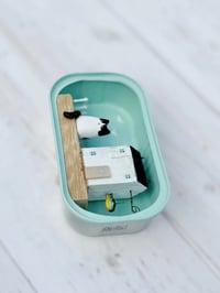 Image 3 of A cottage with a two-tone fish made from a sardine can. Scene made from driftwood.