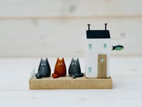 Image 1 of Cat House. Scene with Driftwood.