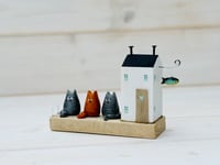 Image 2 of Cat House. Scene with Driftwood.