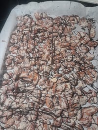 Chocolate drizzled cheesecake pecans