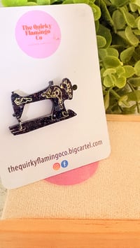 Sewing machine brooch